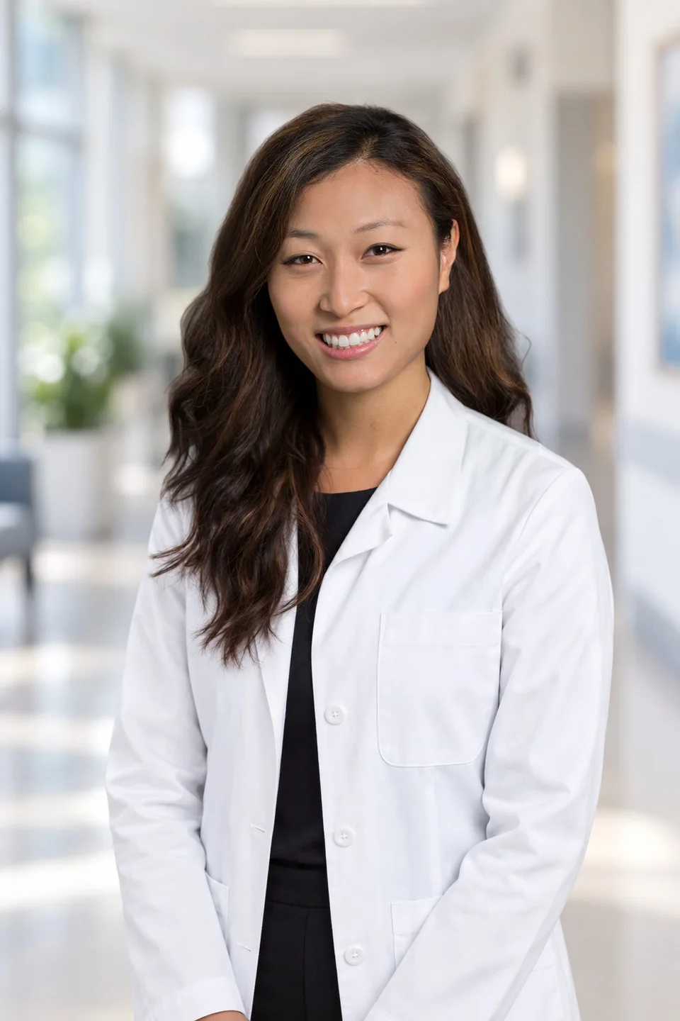 Dr. Jeannie Su in her white coat